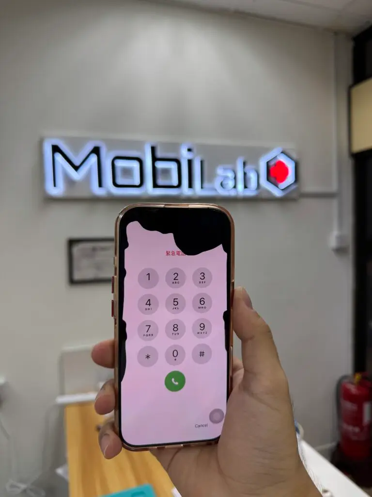 Damaged iPhone OLED display with liquid bleed before screen replacement
